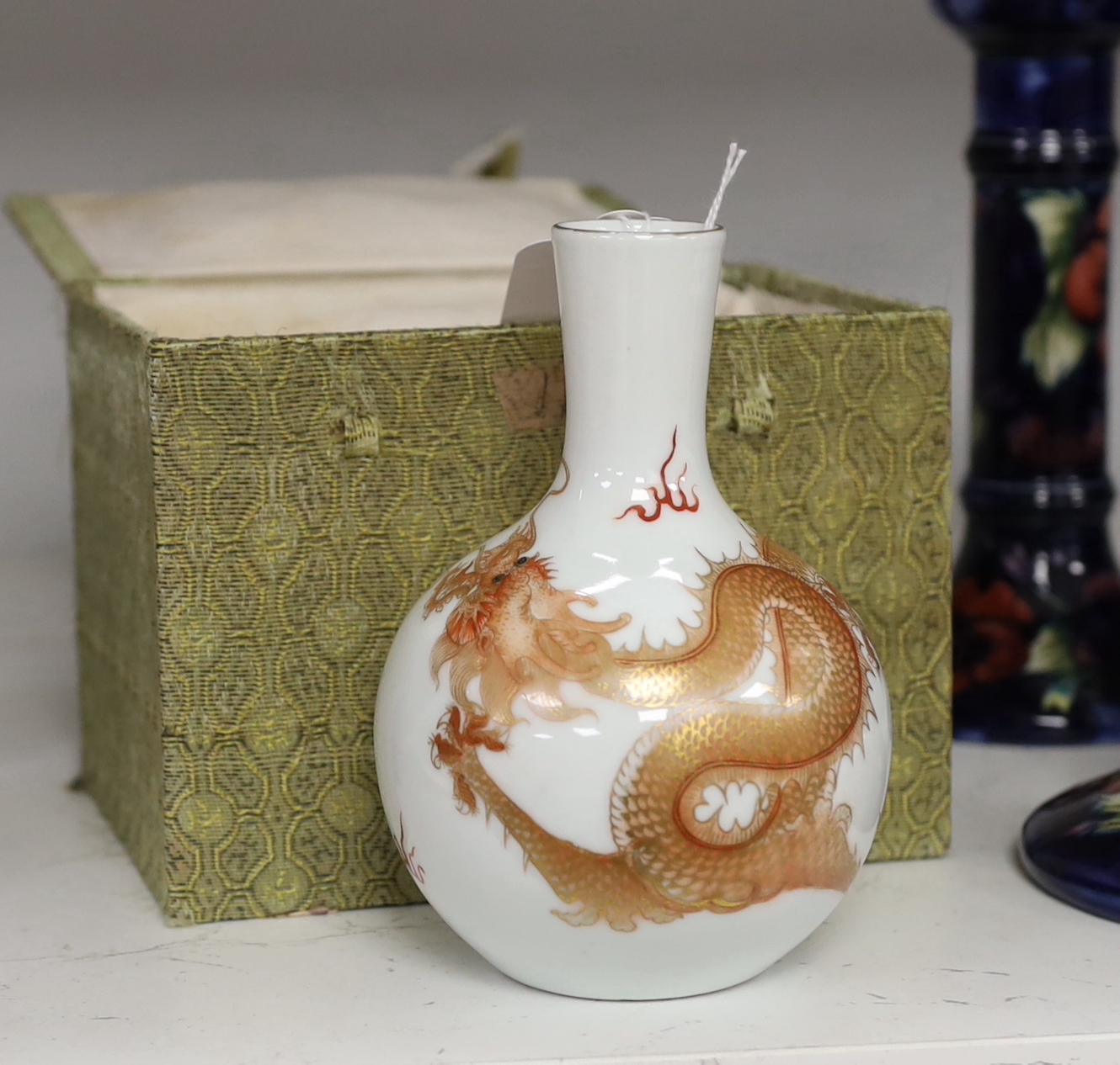 A Chinese rouge de fer dragon bottle vase, 14cm high (boxed)